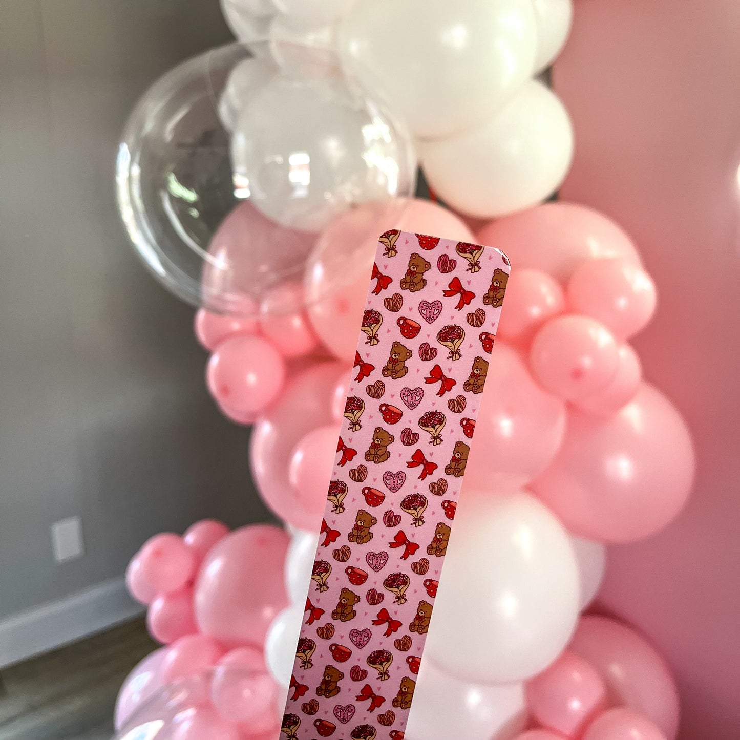 A charming pink Valentine’s Day bookmark featuring a hand-drawn design.