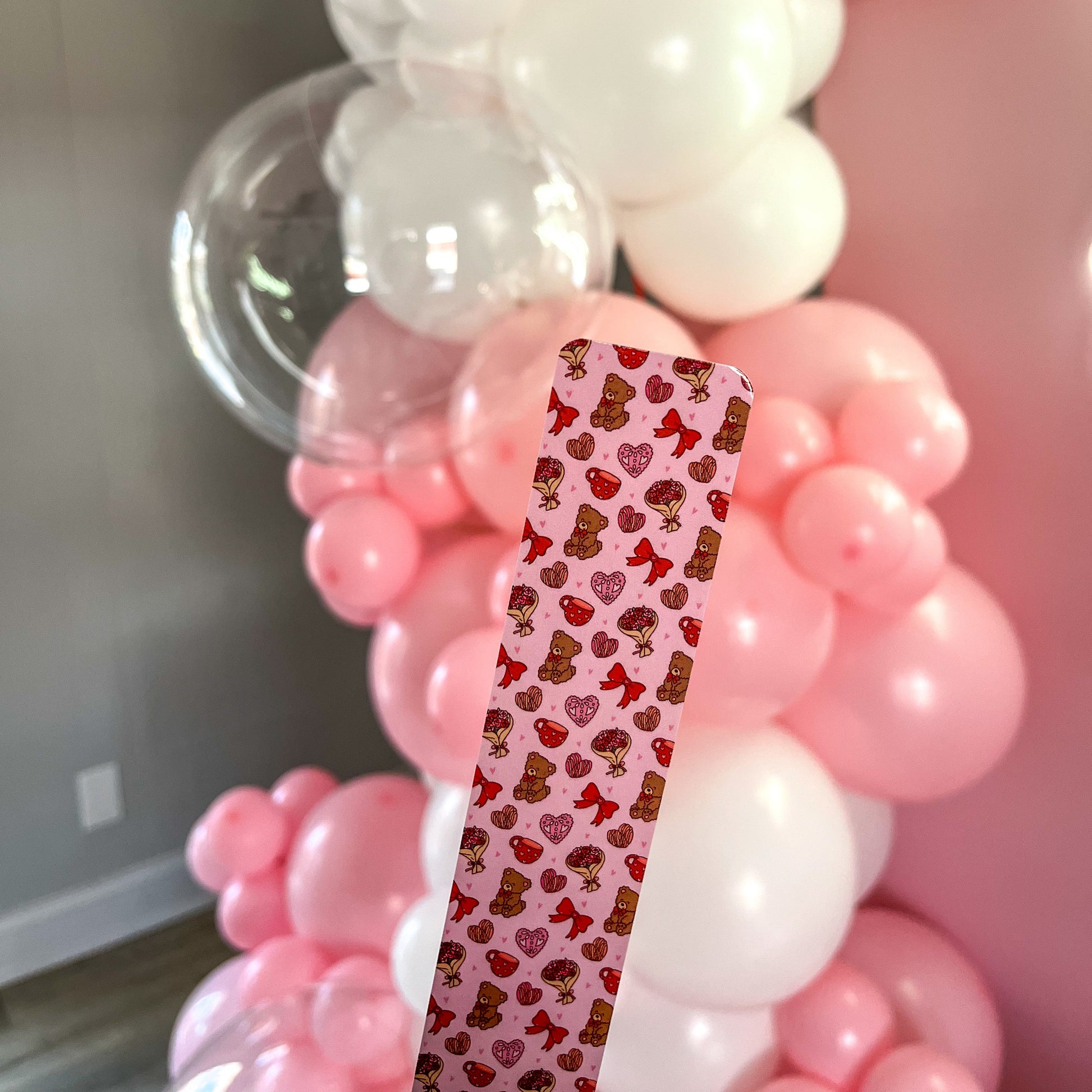 A charming pink Valentine’s Day bookmark featuring a hand-drawn design.