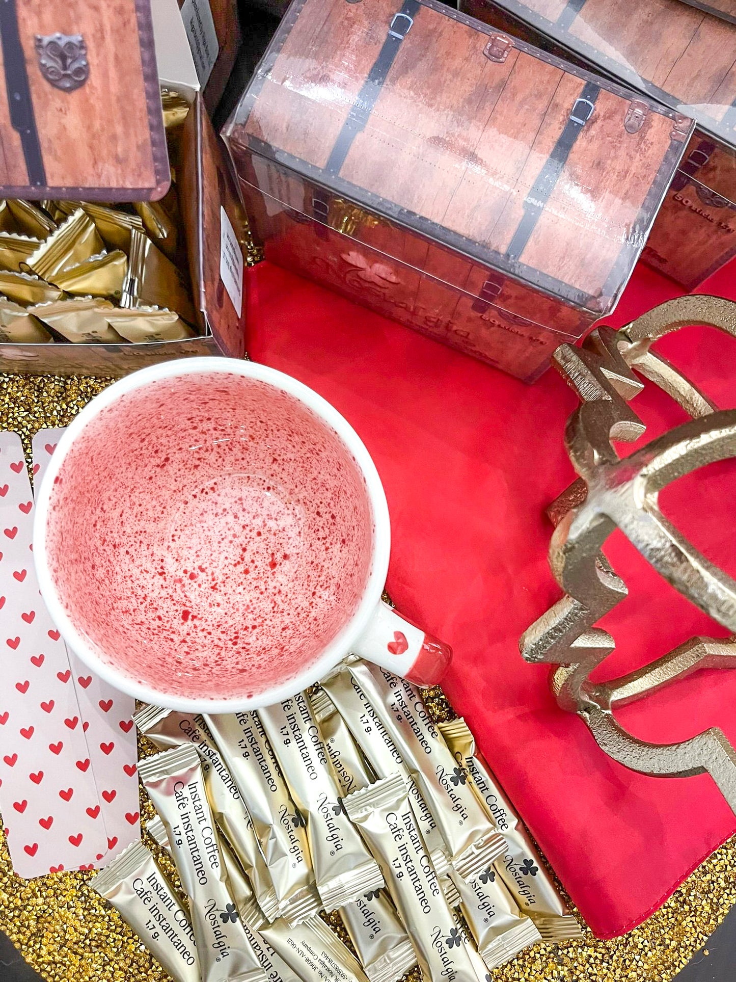 Red heart ceramic mug featuring a heartfelt design, paired with Ikigai Bold Nostalgia Ecuadorian coffee. The perfect Valentine's Day gift, combining love and the rich flavors of premium Ecuadorian coffee for a memorable experience.