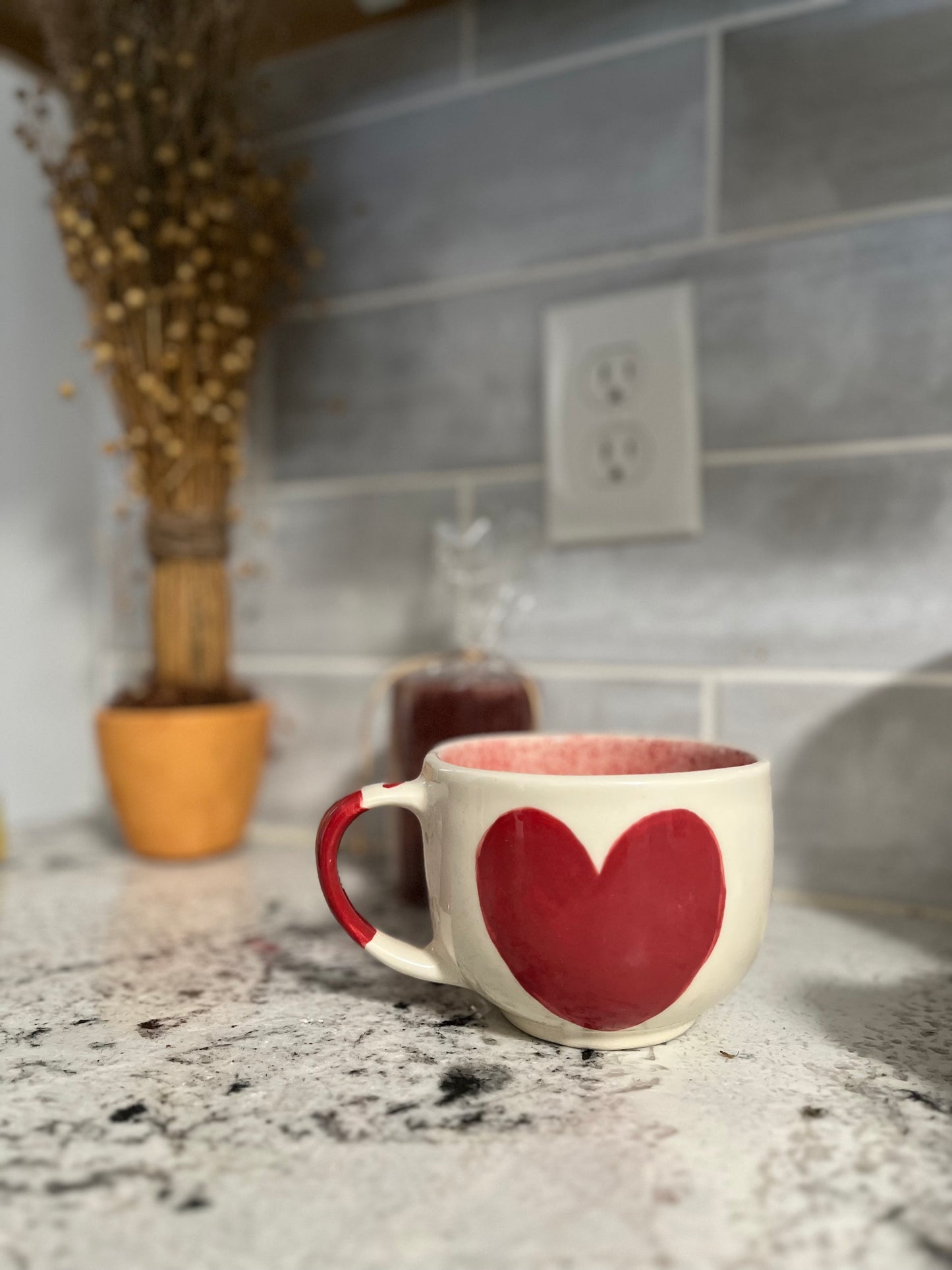 A 16 oz ceramic mug made in Mexico, sitting on a countertop in a cozy kitchen. The mug features a vibrant, hand-crafted design, adding a touch of warmth and color to the space. Perfect for enjoying your favorite hot beverage.