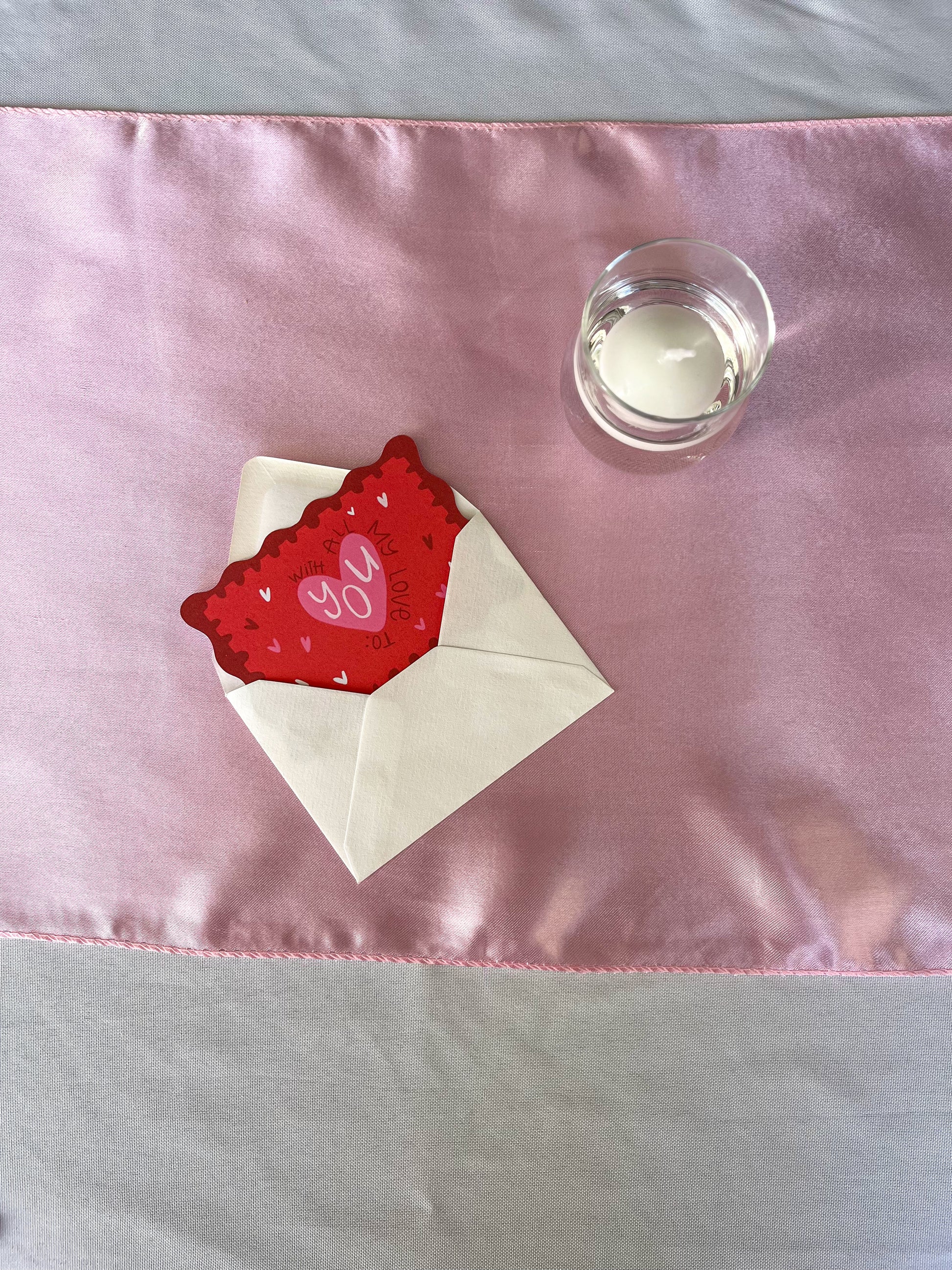 A beautifully designed Valentine’s card in red hue, featuring “WITH ALL MT LOVE TO: YOU” in bold, elegant text. The side of the card remains blank, allowing you to add a personal name or message. Perfect for expressing love on Valentine’s Day or for any meaningful occasion.