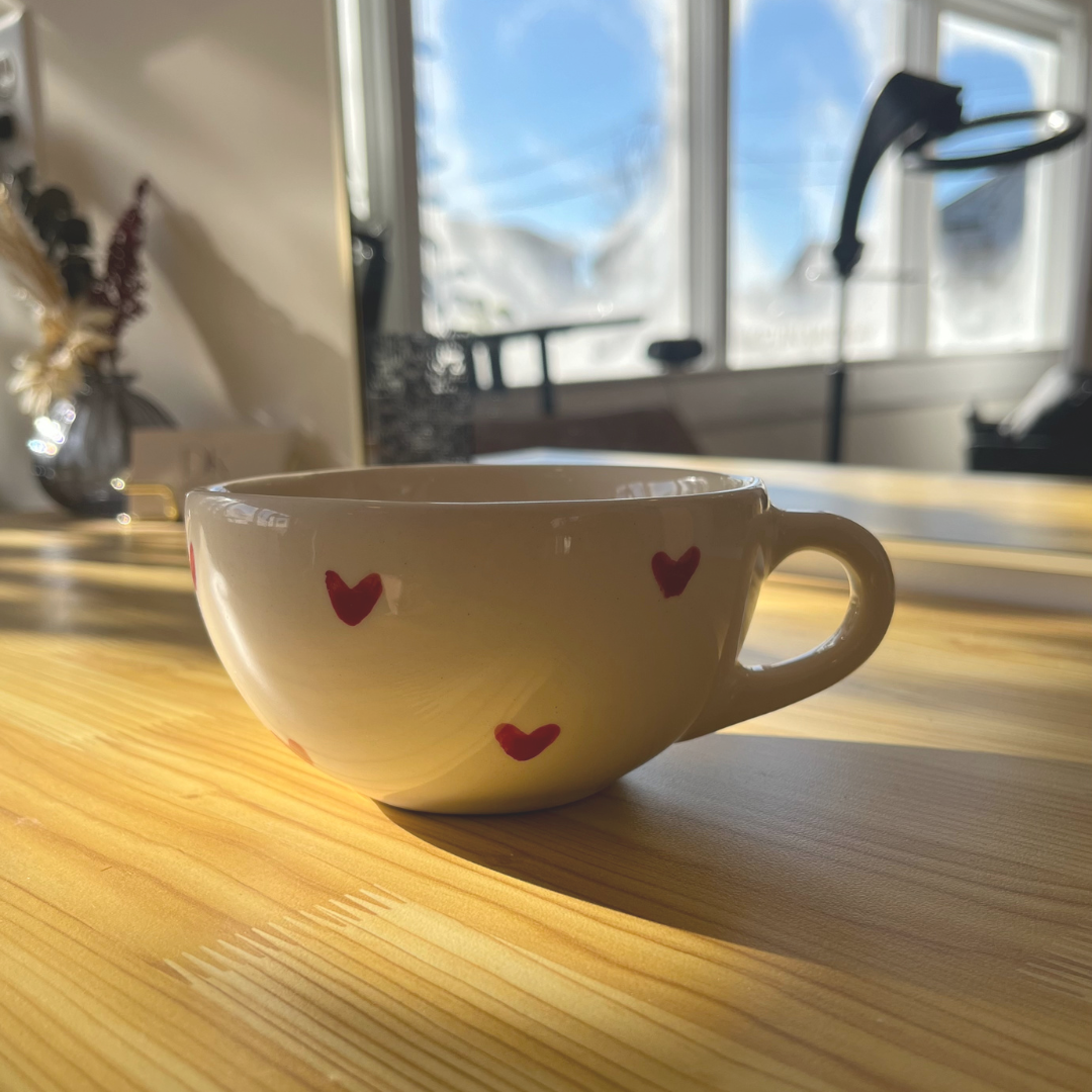 Add a touch of charm to your coffee routine with this handmade ceramic mug, featuring tiny red hearts. Thoughtfully crafted in Mexico, it’s the perfect blend of style and warmth.