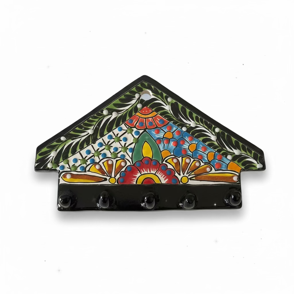 Decorative wall hook with colorful floral design on a white wall