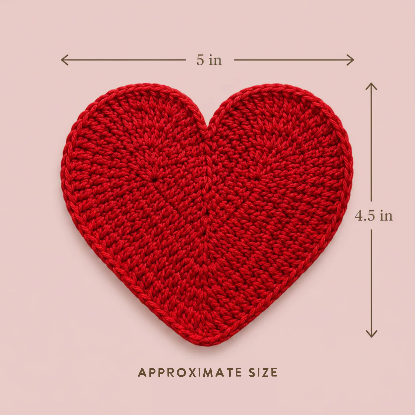 Red crochet heart with measurements on a pink background