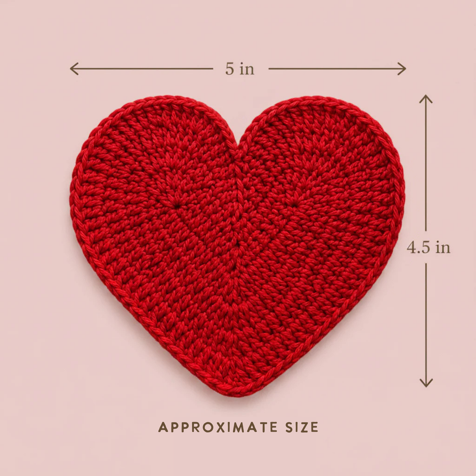 Red crochet heart with measurements on a pink background