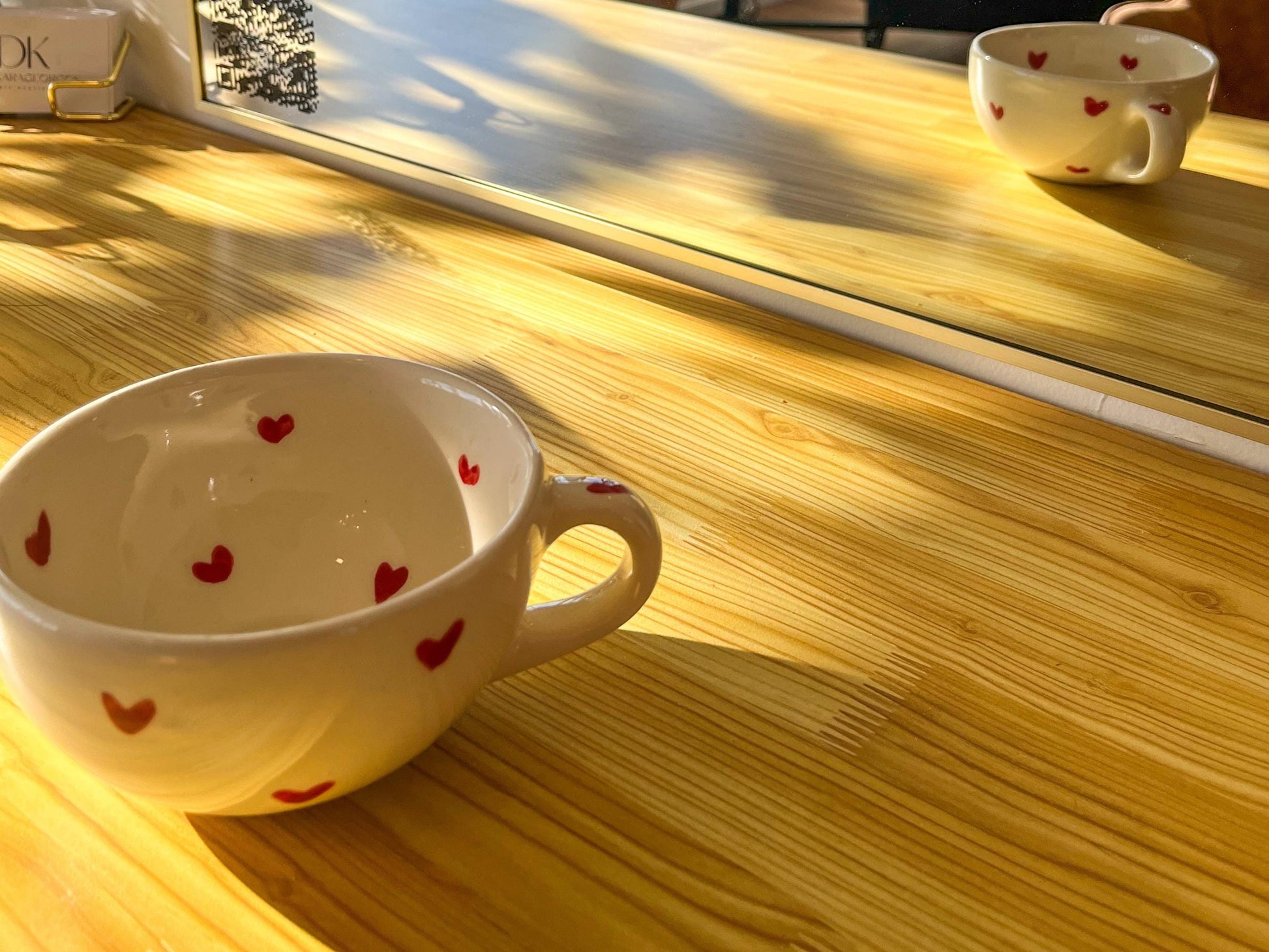 Heart ceramic mug facing mirror showing full design and reflection, aesthetic vibe