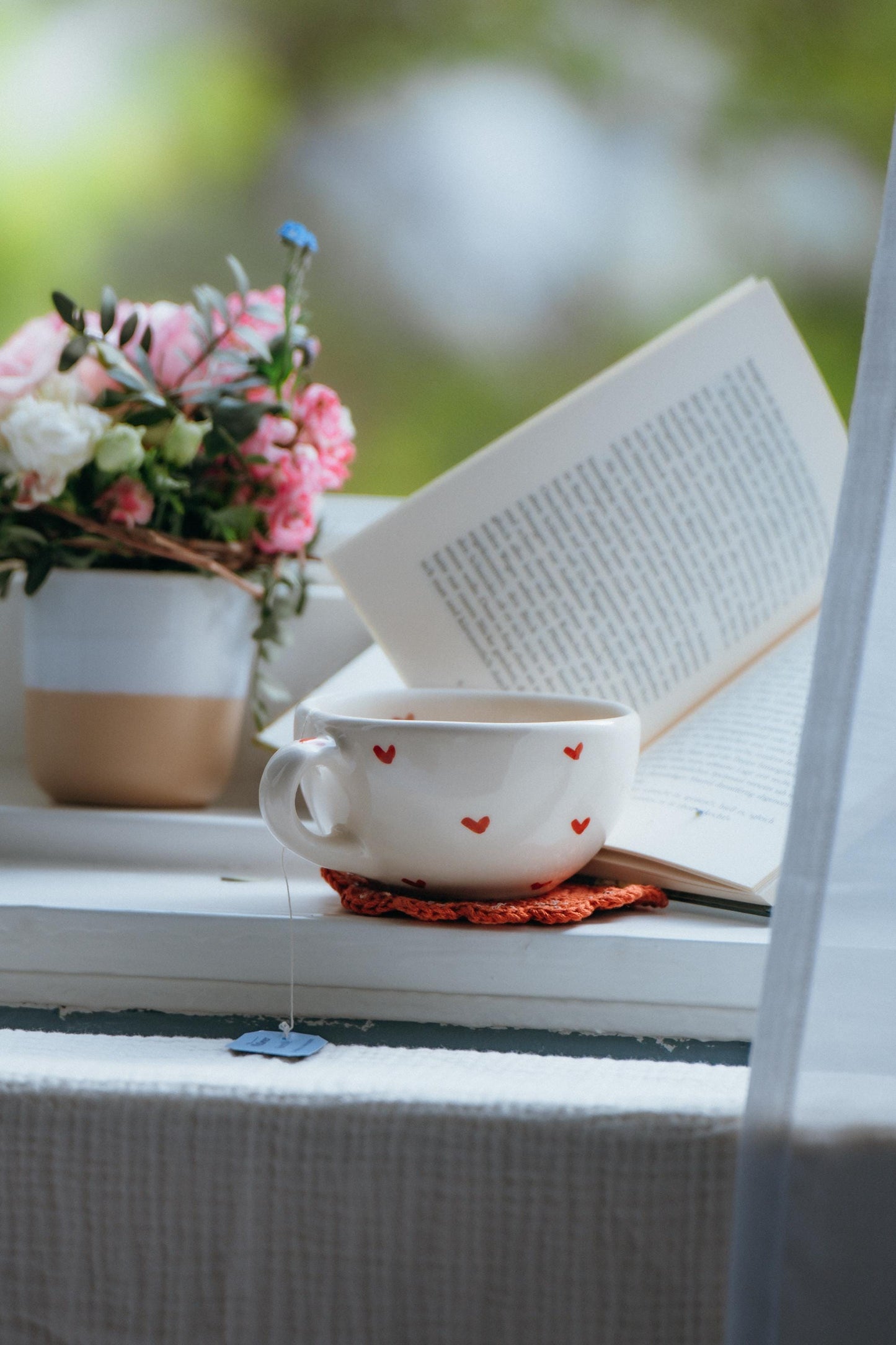 Handmade ceramic heart mug with free crochet coaster, cozy coffee cup.