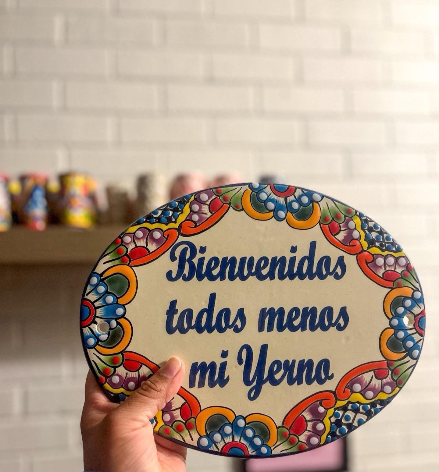 Ceramic "Bienvenidos Todos Menos Mi Yerno" Wall Sign 10" x 8"