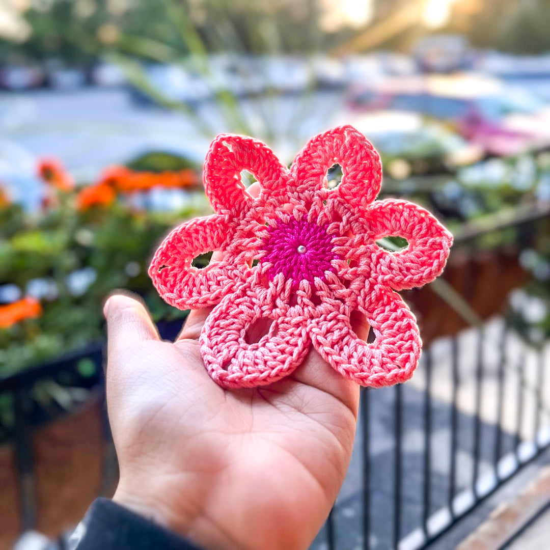 Artisan made flower crochet coaster in pink colors, ideal for tea and coffee lovers.