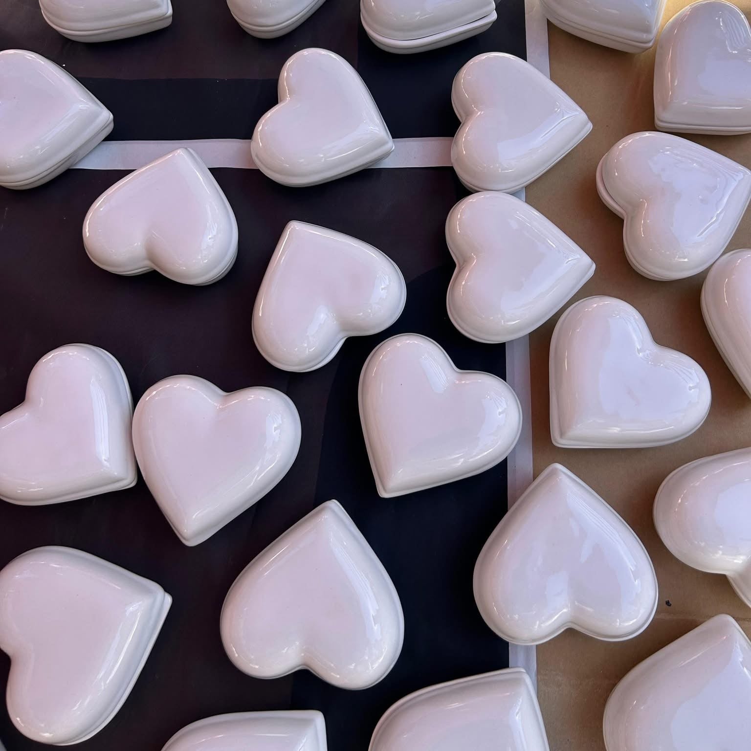 heart-shaped ceramic jewelry boxes, made in Mexico. These charming boxes are perfect for storing rings, earrings, or other small treasures, adding a unique and colorful touch to any vanity or dresser.